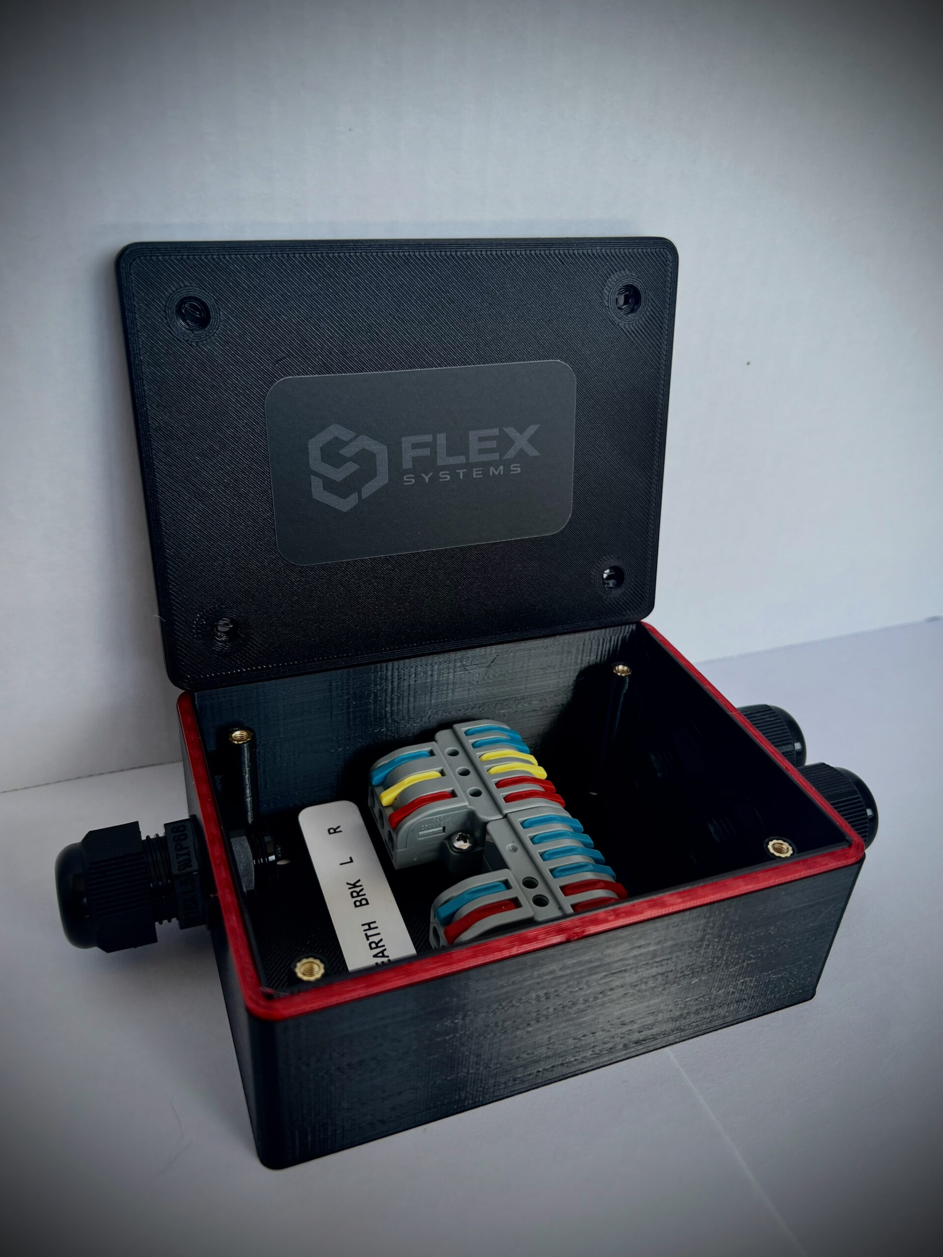 Inside a Flex Systems trailer junction box showing colour-coded lever terminals