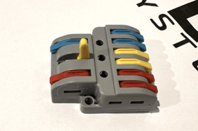 Orange lever lifted to open a Flex Systems junction-box terminal